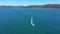 Drone, mountains and environment with yacht in ocean for sailing, travel and summer vacation. Nature, tropical and