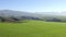 Drone, mountains and field in nature, landscape and outdoor for growth, ecology and environment. Aerial view, hill and