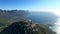 Drone, mountains or nature with a view of the land and sea in Cape Town, South Africa during summer. Aerial, earth and