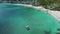 Drone, ocean and boat on beach for travel in Cape Town with rocks, coral reef and transport or house. Aerial view, ship