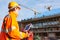 Drone operated by construction worker on building site