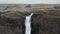 Drone orbiting around the jump of the famous Haifoss waterfall in south Iceland. Aerial view of spectacular famous