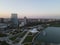 Drone over harbor with cityscape at seaside in Wisconsin at sunset