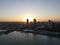 Drone over harbor with cityscape at seaside in Wisconsin at sunset