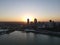 Drone over harbor with cityscape at seaside in Wisconsin at sunset