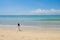 Drone over kissing bride and groom on beautiful beach, Bali