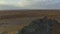 Drone over a rocky ridge among the sandy desert