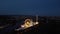 Drone panning move of the fair Maidult in Regensburg, Bavaria, Germany with ferris wheel and beer tents at night