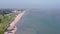 Drone panning shot of Shoebury beachside city buildings and the seascape