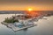 Drone panorama of Croatian coastal town Porec with harbor and promenade during sunrise