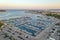 Drone panorama of Croatian coastal town Porec with harbor and promenade during sunrise