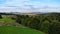 Drone panorama of spring landscape of evergreen forest and mountains with dramatic sky