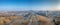 Drone panorama of World War II memorial with Kansas City skyline during sunrise