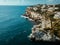 Drone panoramic image moored yachts on bright blue bay Cala Blanca Andratx, Palma de Mallorca, rocky coast breathtaking