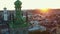 Drone passes by authentic spires of Latin Cathedral, Assumption church and town hall in majestic Lviv, Ukraine on sunset