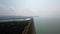 Drone perspective view of Hirakud Dam of Odisha with fast moving cloud over it