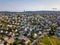 Drone Photo of the City Trondheim in Norway on Sunny Summer Day with Mountains, Fjord and Port in the Background