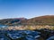 Drone Photo of the City Ã…ndalsnes in Norway on Sunny Summer Day with Mountains, Fjord and Port in the Background