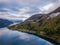 Drone Photo of the Cityscape of Leon in Norway with the Innvikfjorden Fjord in the Foreground and the Clouds Covering big