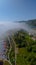 Drone photo of dense coastal fog in a fjord at summer..