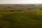 Drone photography of agricultural field and tractor tire tracks