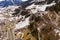 Drone photography of mountain sky slope, railway bridge going over slope and sky lifts