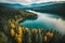 Drone Pine Trees Forest with Tranquil Lake reflections, beautiful sky, cinematic color grading, Wallpaper nature