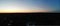 Drone PoV: Chicago skyline silhouette backlit jusst before sunrise