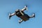 Drone with propellers flies in sky and photographs landscapes