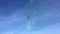 Drone quadrocopter flying over clouds on blue sky backgrounds