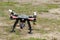 A drone is ready to fly and hovered above the ground before the race