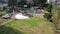 Drone rises above a beautiful gazebo in the park