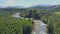 Drone Rises above Narrow Mountain River among Jungle
