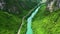 Drone, river and path with road in forest for environment, countryside wildernesses and trees. Travel, landscape and
