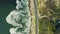 Drone, road and landscape with ocean, nature and water with environment, waves and travel. Top view, street and beach