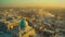 Drone\\\'s Eye View: Dusty Middle Eastern Muslim City at Sunset beautiful cityscape with mosque dome on foreground.