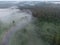 Drone\\\'s Eye View: Serene Sunrise Over Misty River and Woodland Landscape