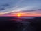 Drone\\\'s Eye View: Serene Sunrise Over Misty River and Woodland Landscape