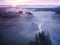 Drone\\\'s Eye View: Serene Sunrise Over Misty River and Woodland Landscape