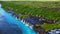 Drone scene of Hraunfossar Waterfall landscape with green hills in Iceland