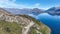 Drone scenery of the shoreline of lake Wakatipu and its surrounding mountain ranges