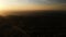 Drone shooting. Forest landscape, valley. Radio tower on top of hill. Sunset.