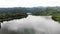 Drone shot aerial view scenic landscape of a big river and nature wood and forest