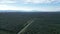 Drone shot asphalt road in oil palm plantation Malaysia