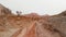 Drone shot of bicyclist ride in canyon desert mountains in Kazakhstan