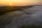 A drone shot capturing a misty morning over the Limestone crags of Malham