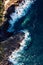 Drone shot of coastline rocky cliff and turquoise water