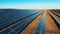 Drone shot of countless rows of solar panels at a massive solar power plant