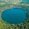 Drone shot of a crater lake known as Yeak Laom Lake which is located in Cambodia.