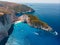 Drone shot of the famous Navagio beach and high limestone walls surrounding the shipwreck at the beautiful turquoise Ionian sea,